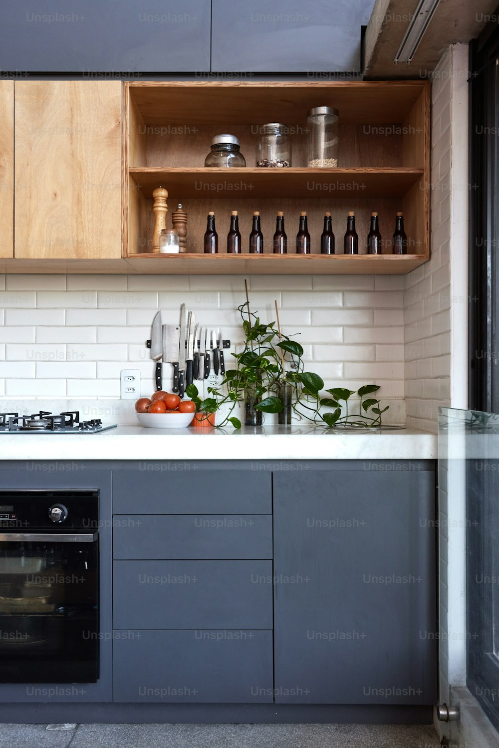 a kitchen with a stove top oven next to a counter