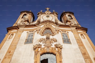 a tall building with a cross on the top of it