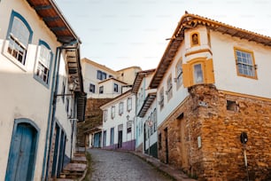a narrow cobblestone street in a small town