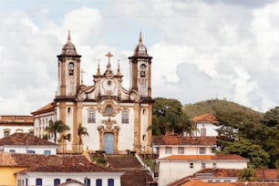 a large church with two towers and a blue door