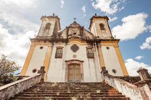 a church with a steeple and a clock on it