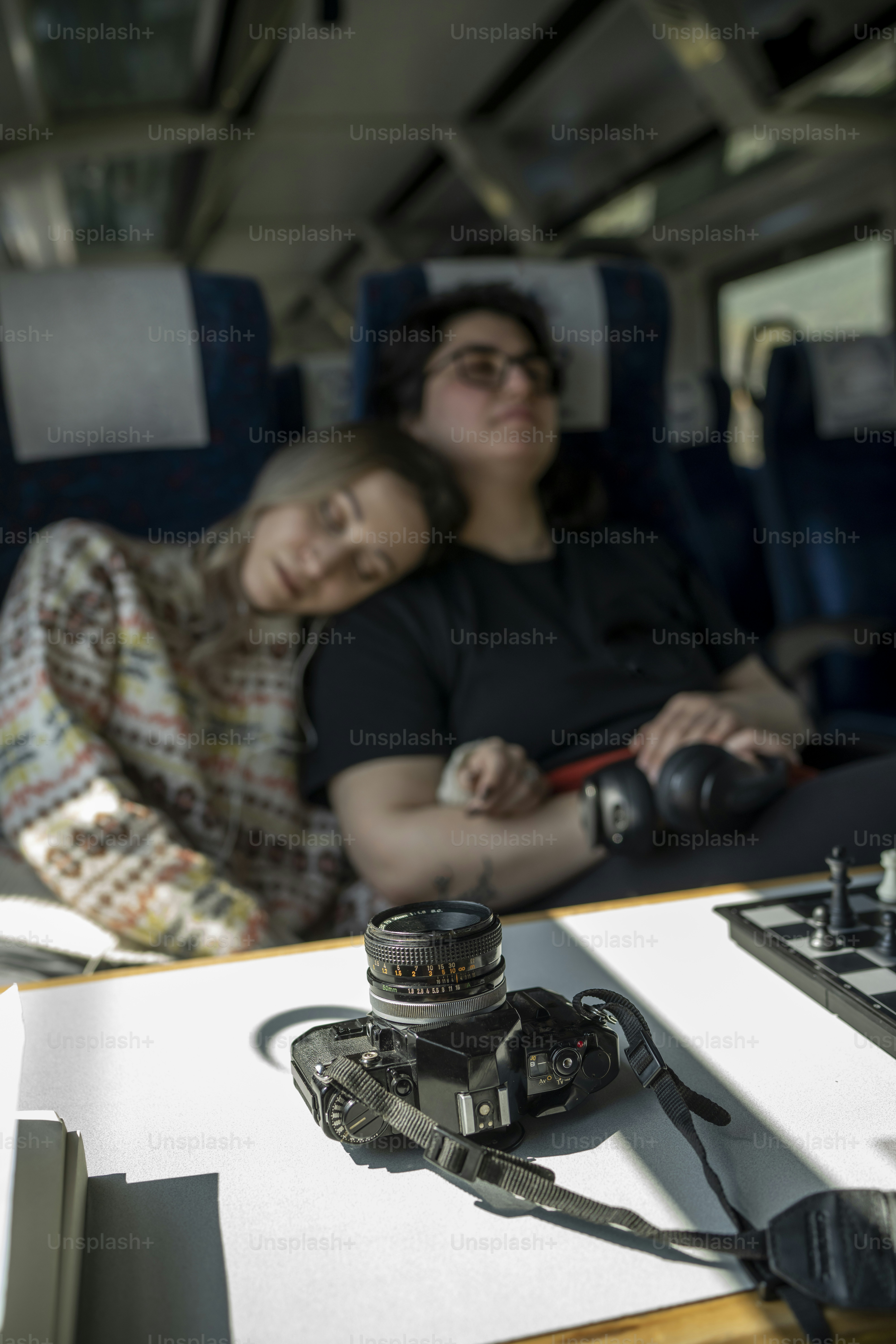 a couple of people that are sitting in a vehicle