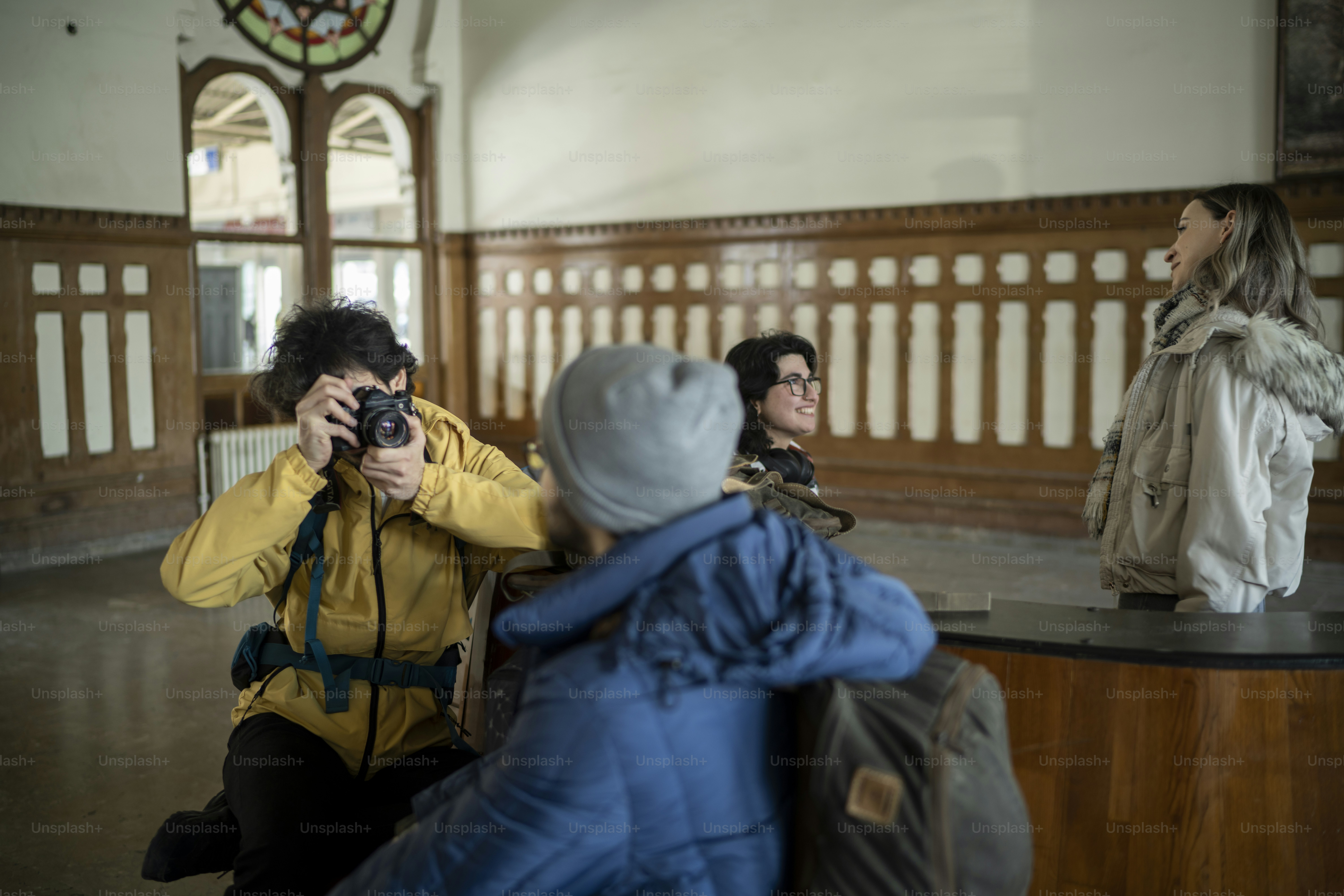 a woman taking a picture of a man taking a picture
