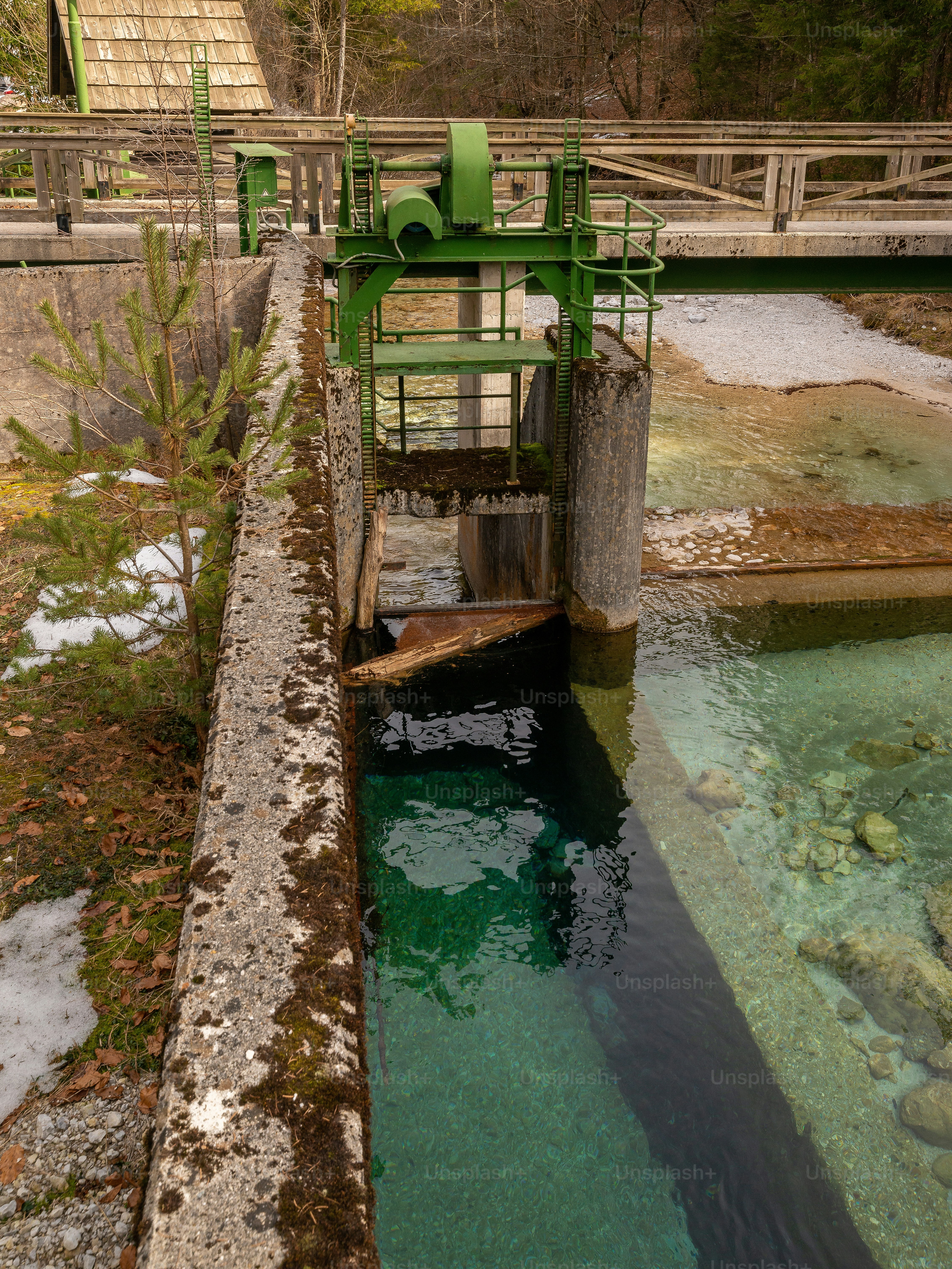 A vintage hydropower plant on a small current near the village Mojstrana in Slovenia, Europe. It used to supply the whole village with electricity. The power plant is still fully functional and part of the existing electrical grid.