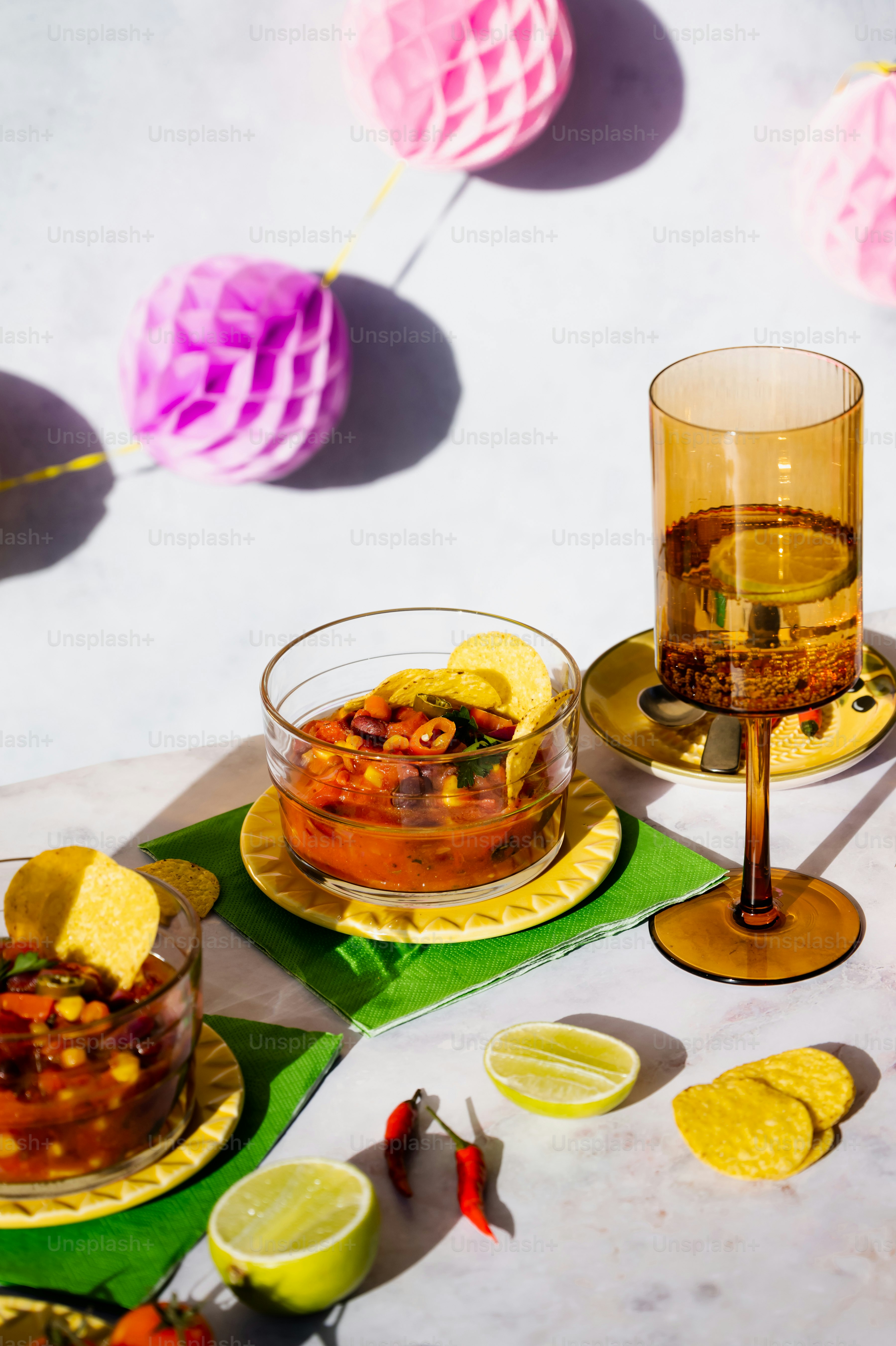 a table topped with plates of food and drinks