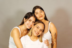 three women are posing for a picture together