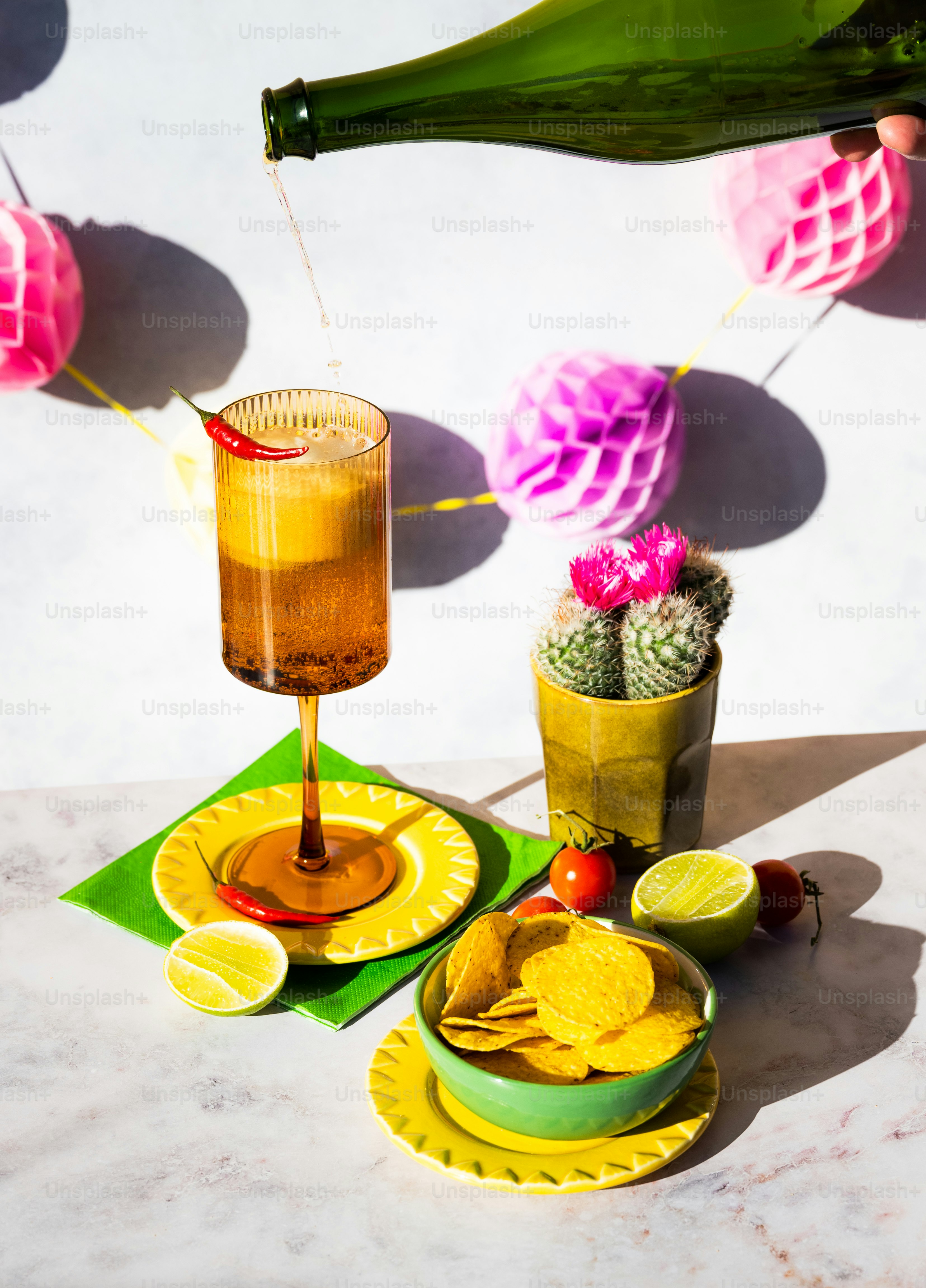 a table topped with plates of food and a bottle of wine