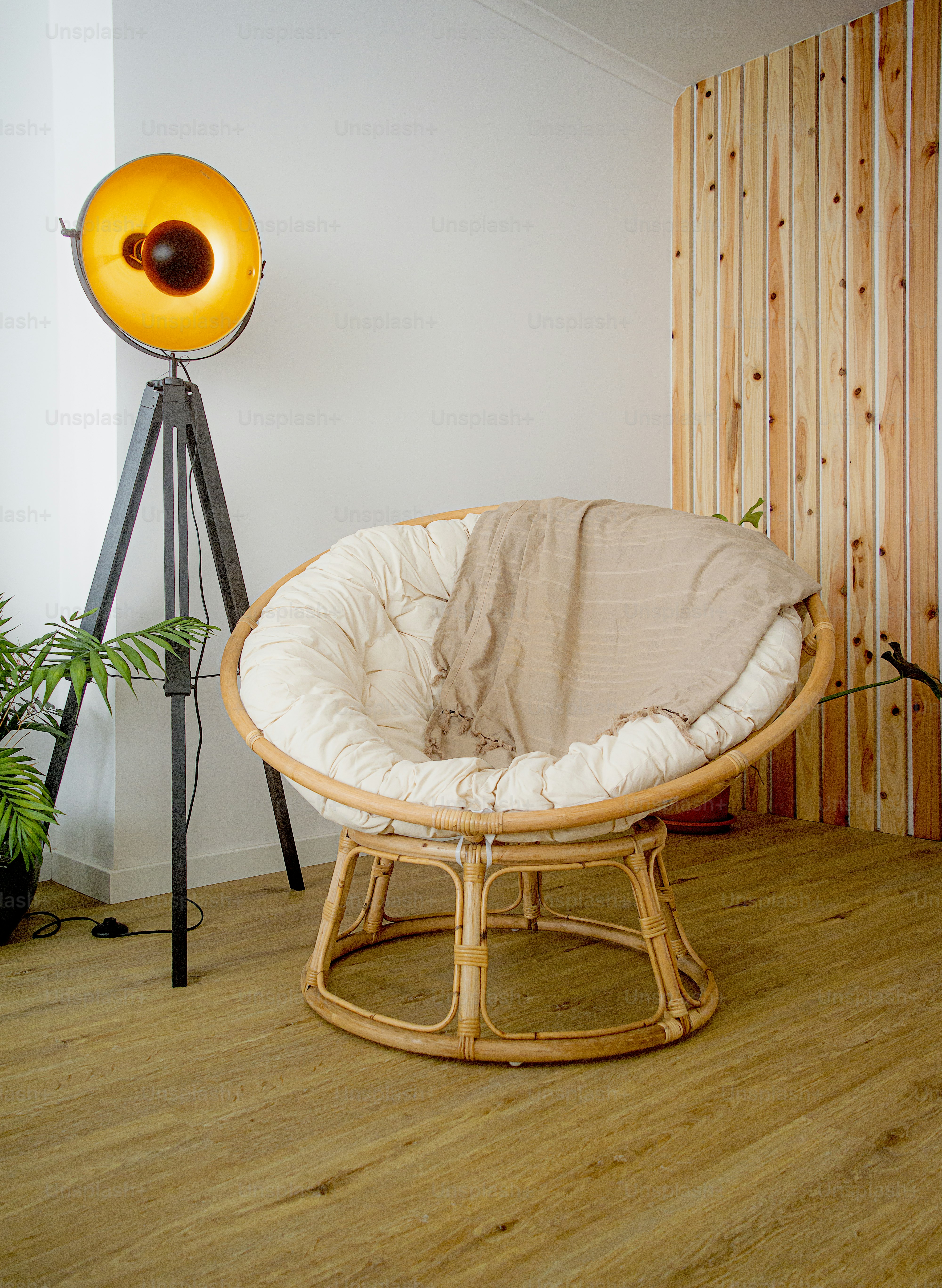 a room with a chair and a floor lamp