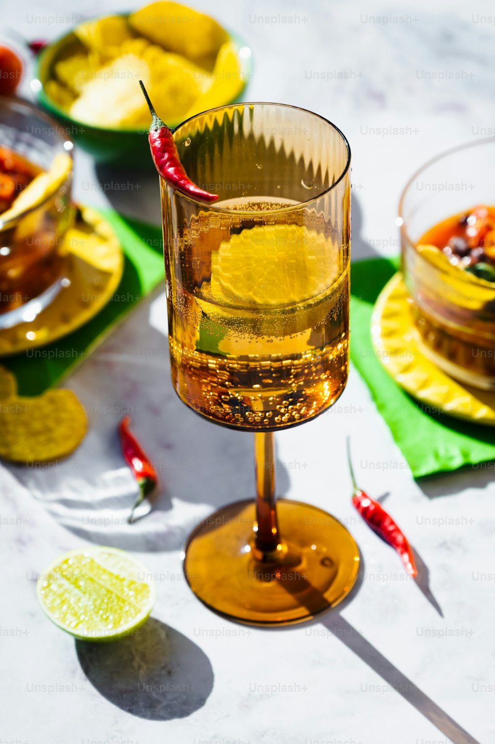 a glass filled with liquid sitting on top of a table