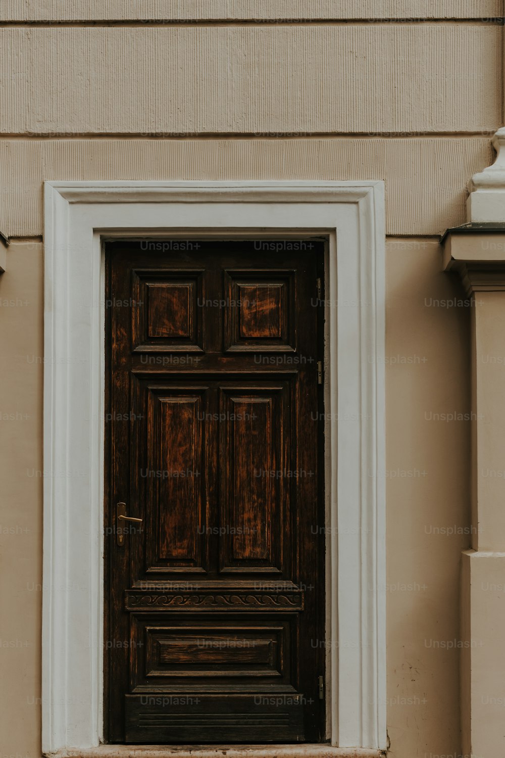 a close up of a wooden door on a building