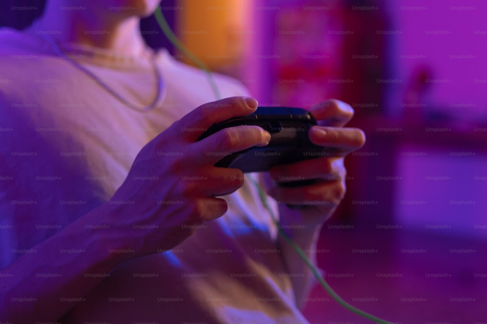 a person holding a game controller in their hands