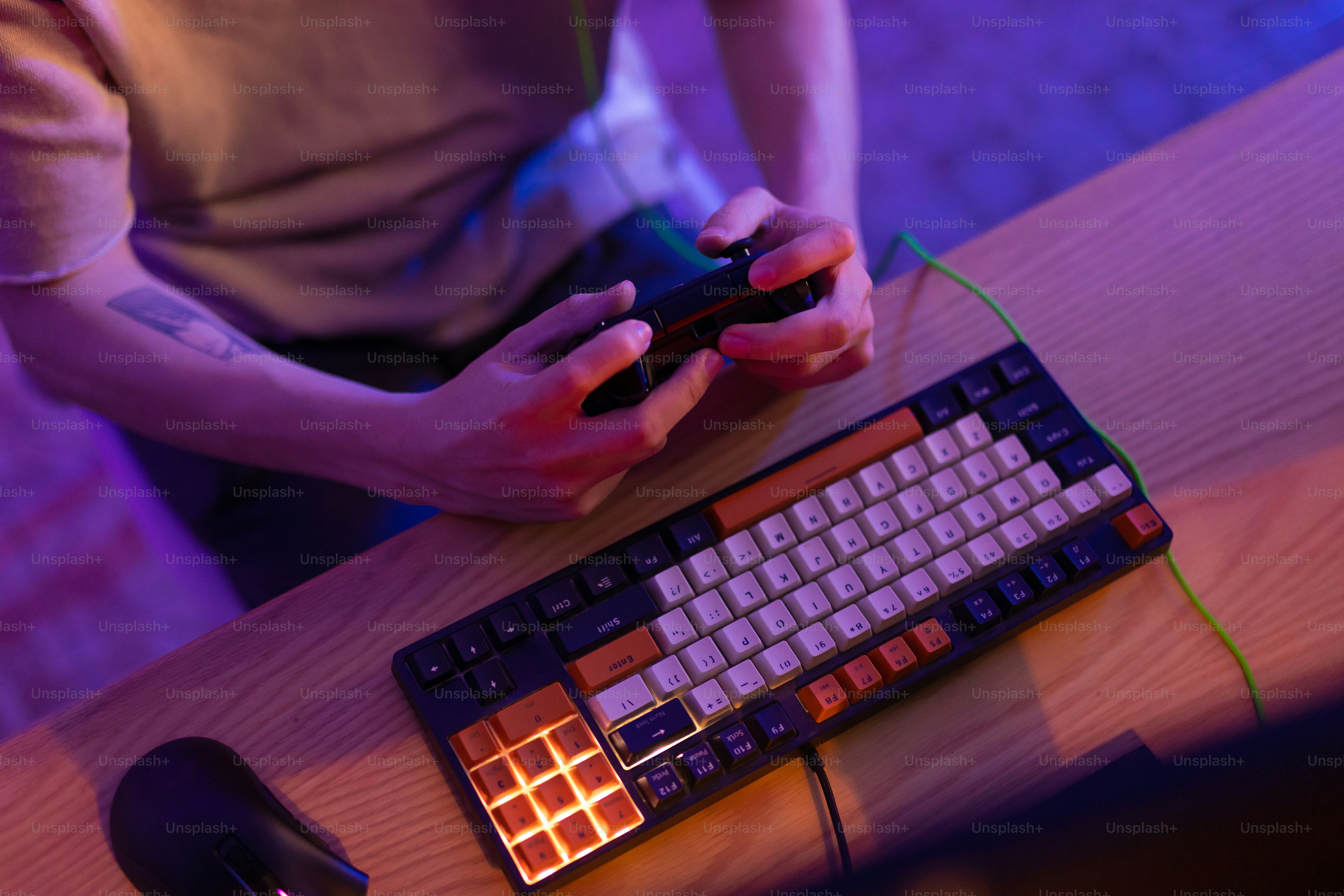 a person holding a phone and a keyboard