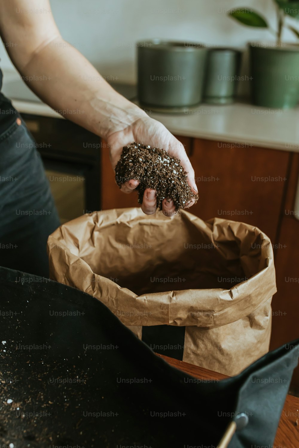 a person holding a bag of food in their hand