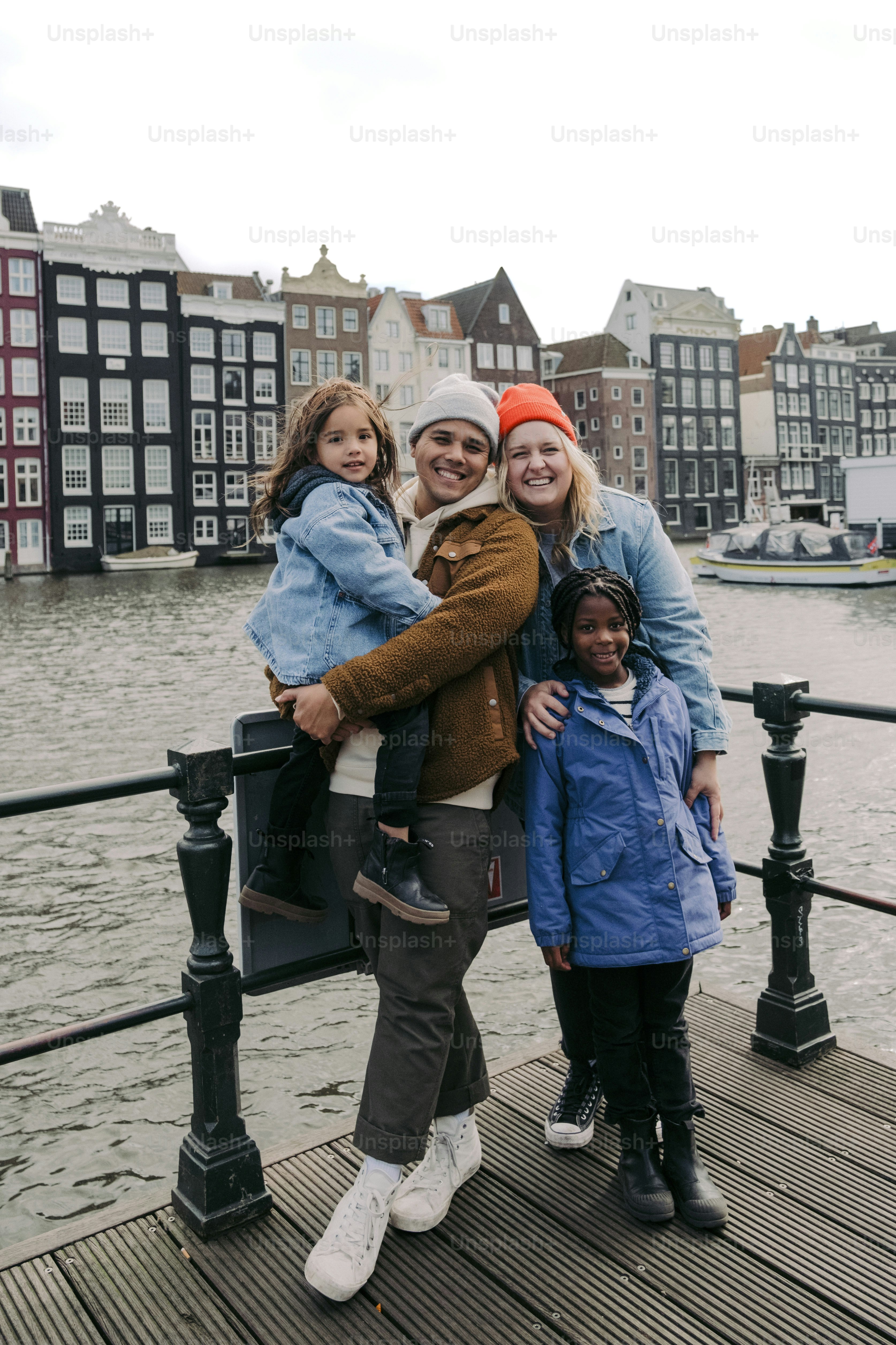 a group of people standing on top of a bridge