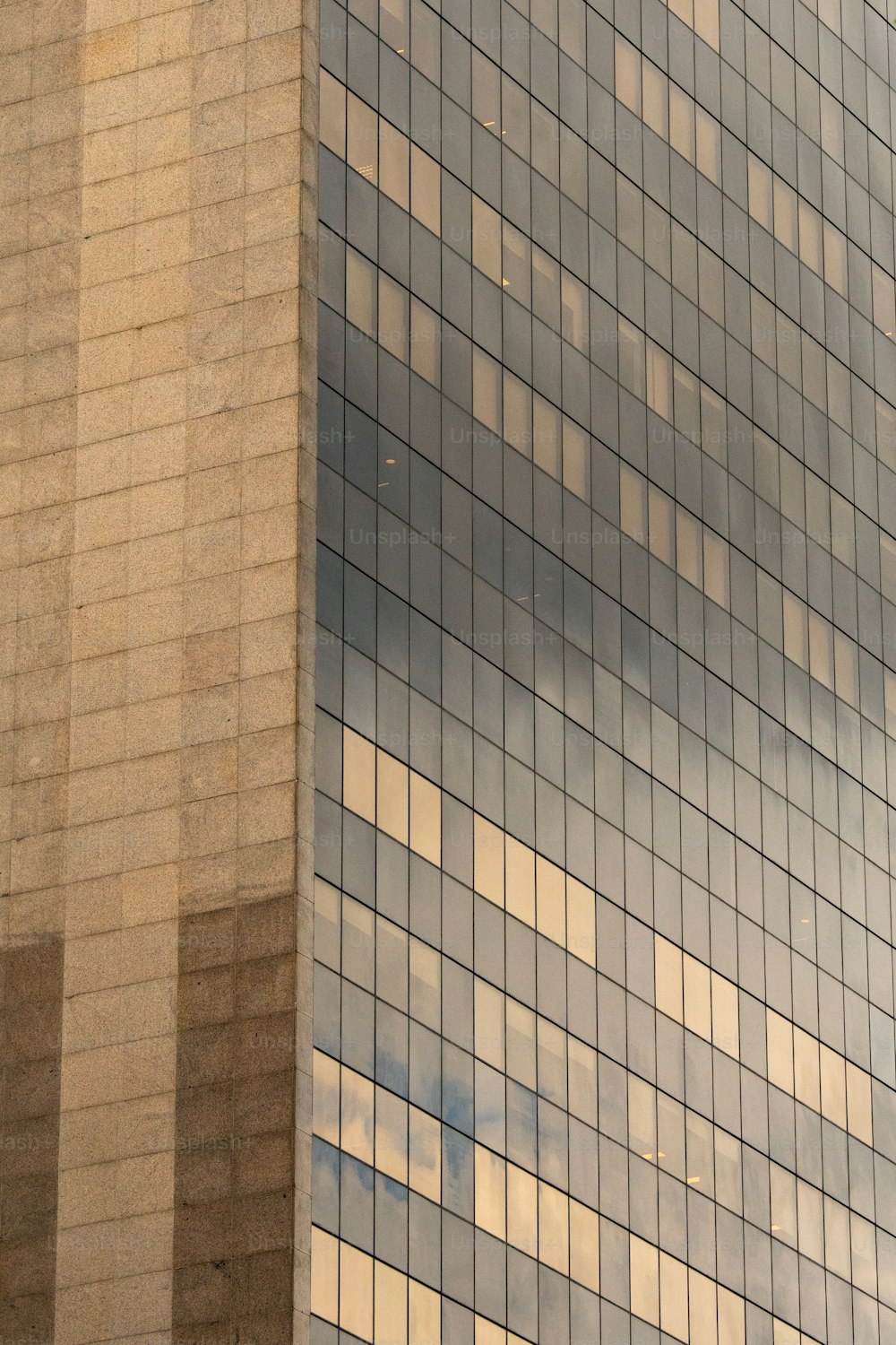 a plane flying in front of a very tall building