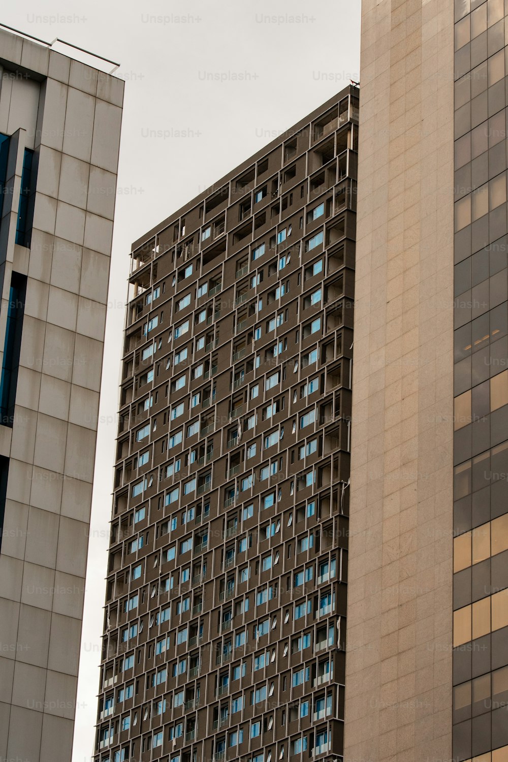 a tall building next to a smaller building
