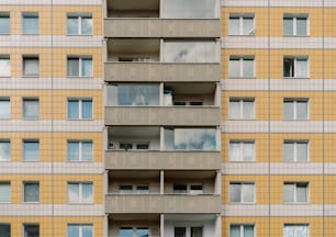 a tall building with balconies and windows