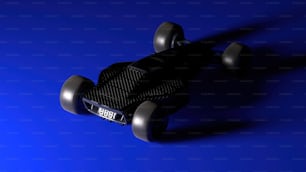 uno skateboard nero con ruote su sfondo blu