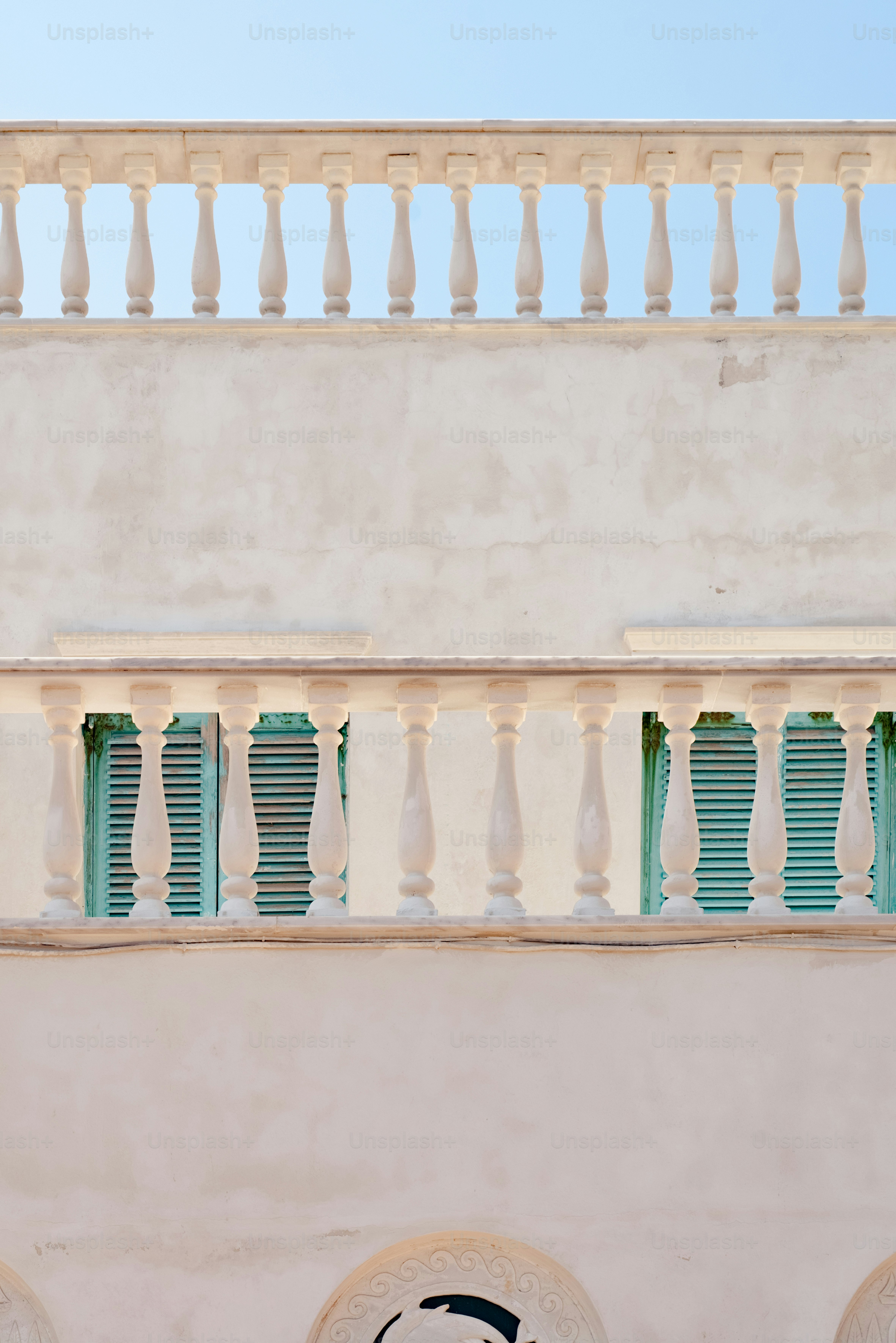 an umbrella is hanging on a balcony of a building