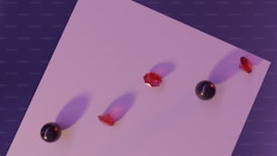 eine Gruppe roter und schwarzer Perlen, die auf einem Papier liegen