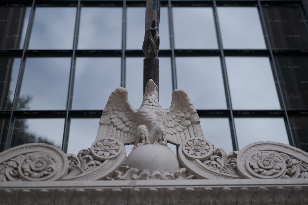 a close up of a clock with a bird on it