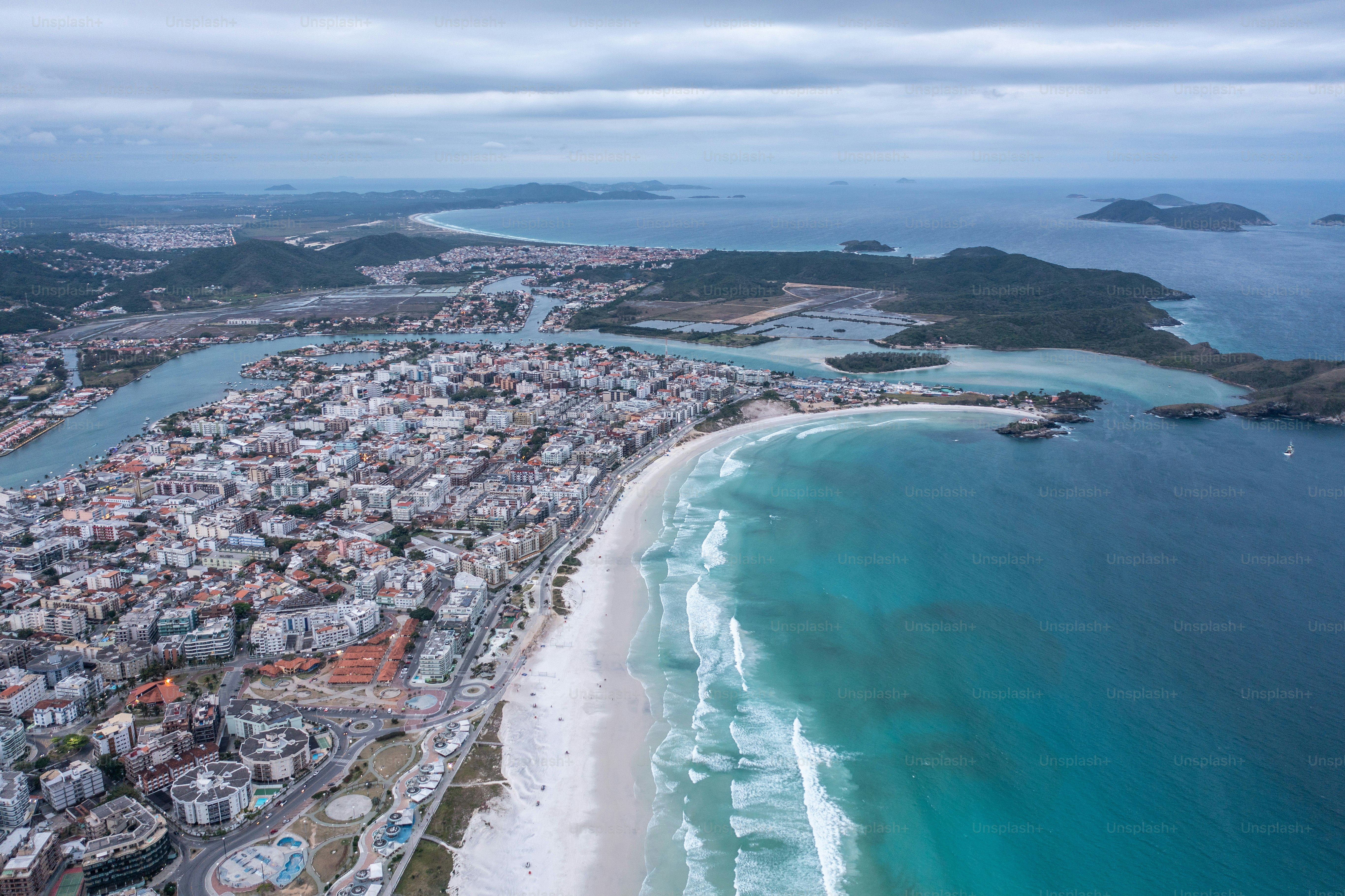 a bird's eye view of a city next to the ocean