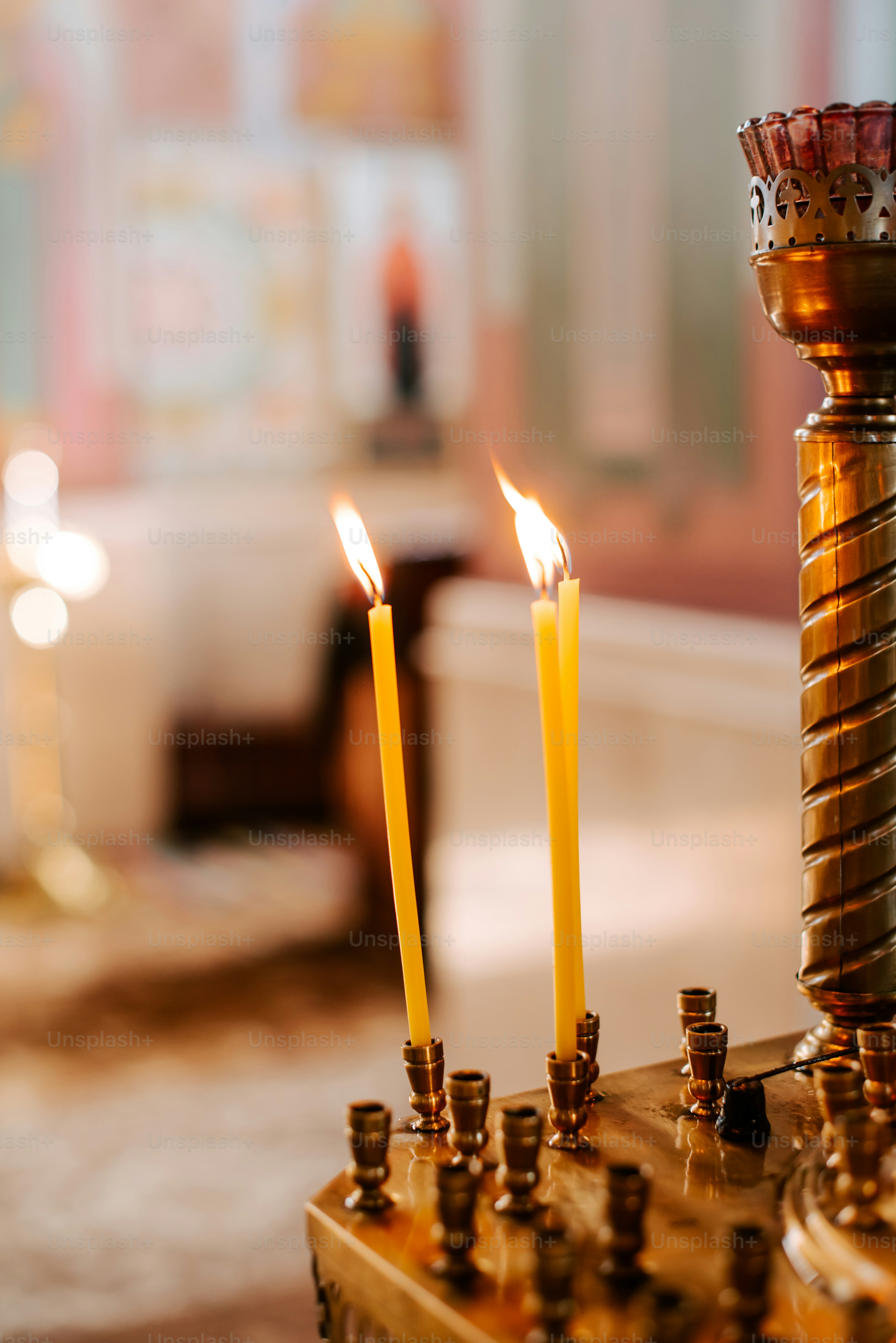 a group of candles sitting on top of a table