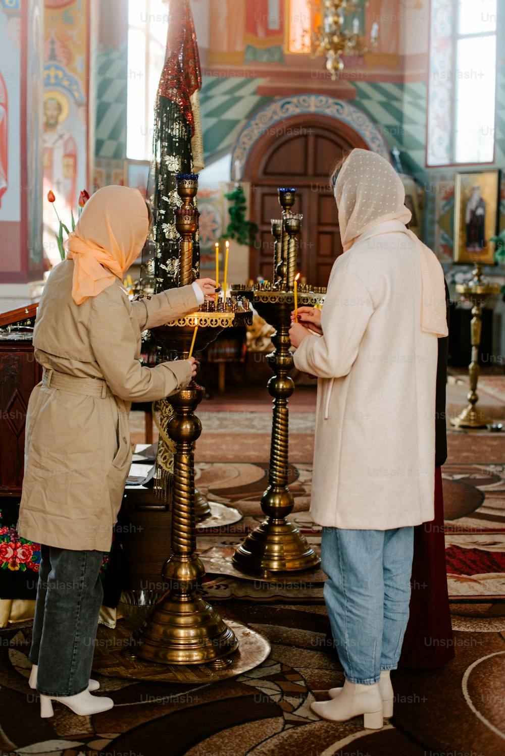 a couple of people that are standing in front of a table