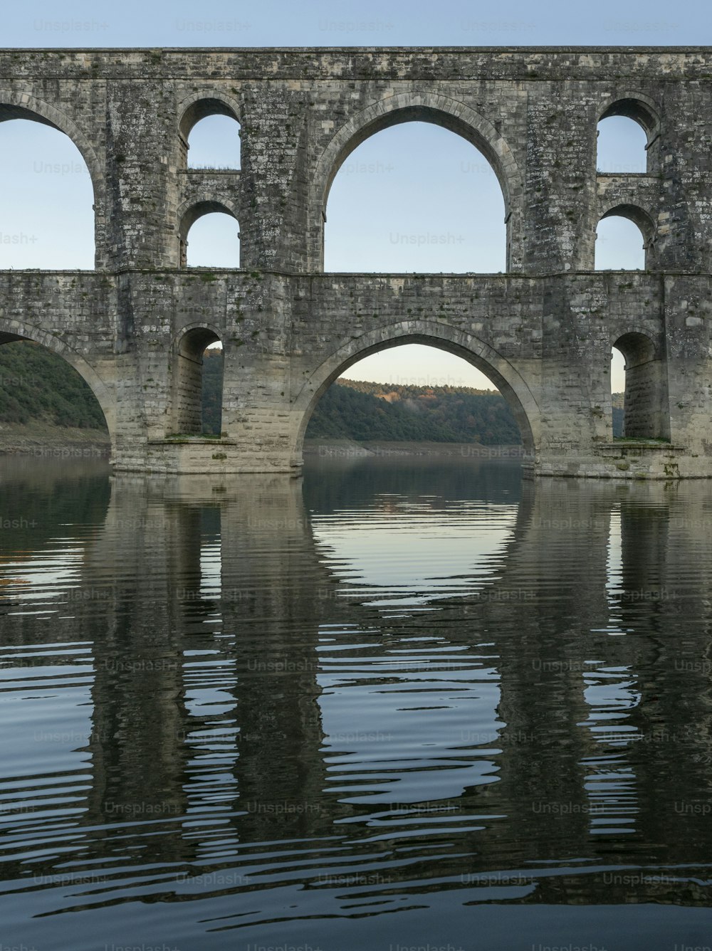 a stone bridge over a body of water