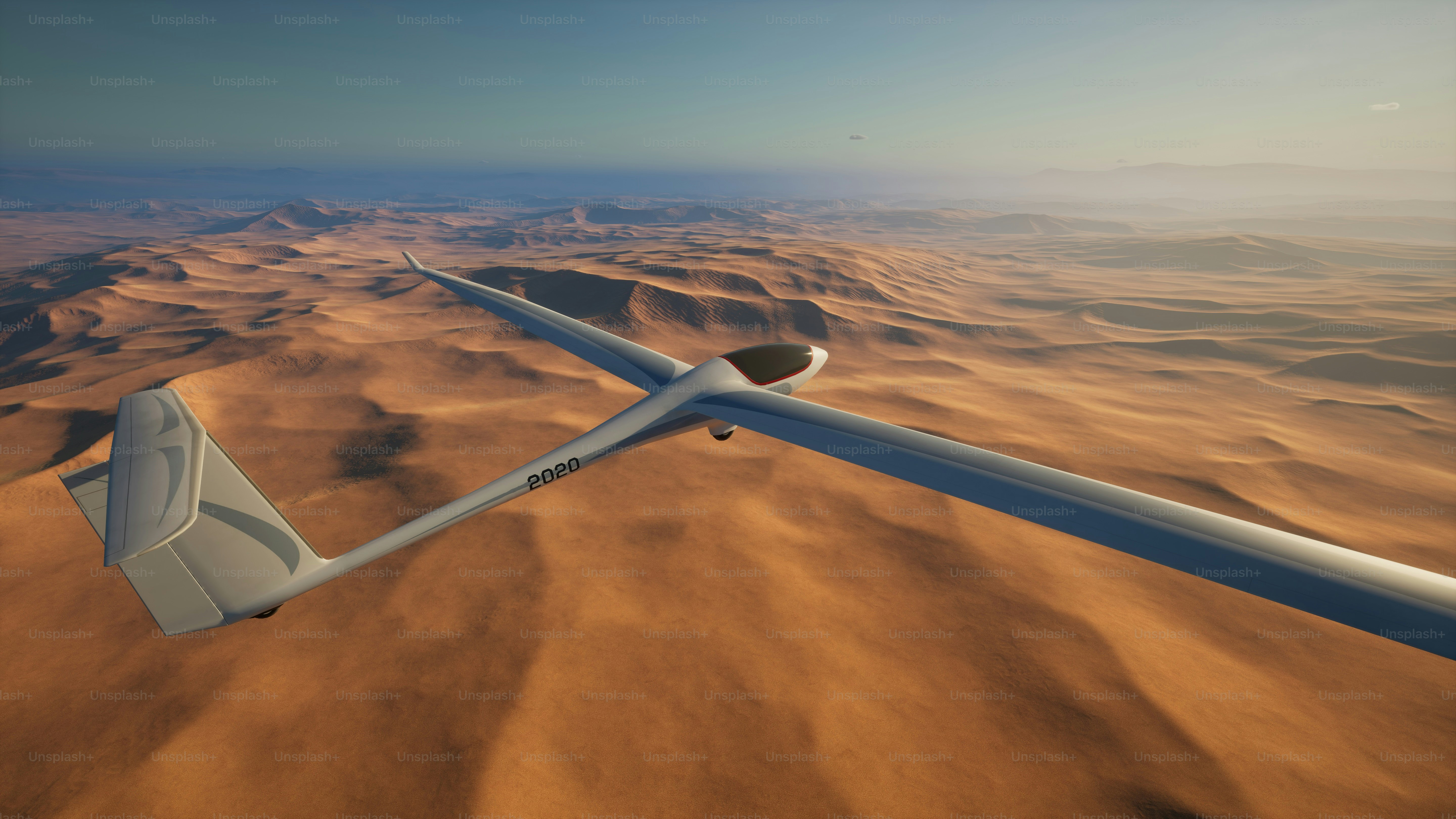 a computer generated image of a glider flying over a desert