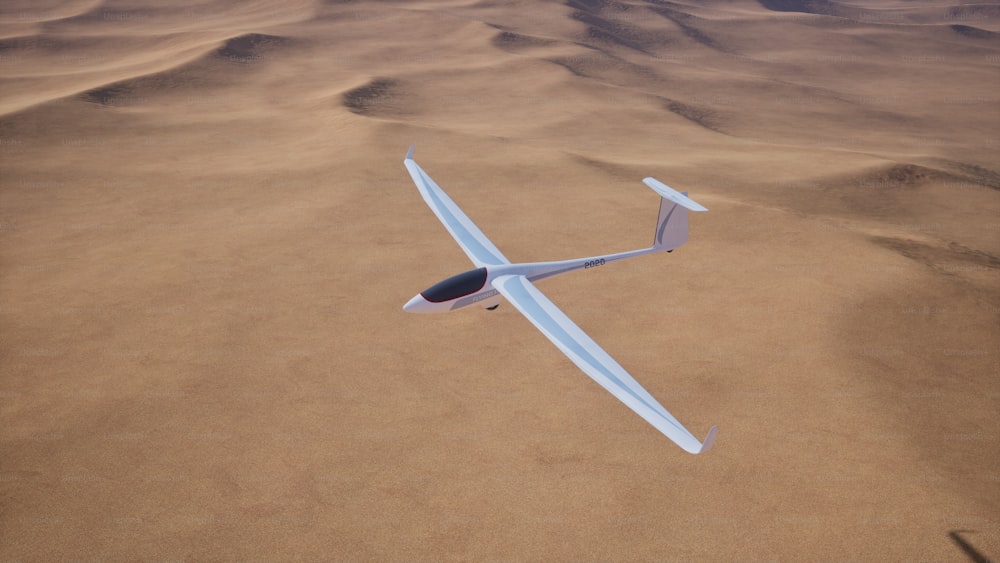 a small airplane flying over a sandy desert