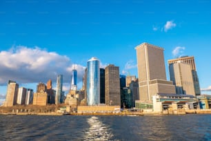 a large body of water with a city in the background