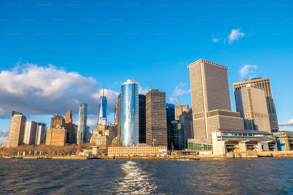 a large body of water with a city in the background