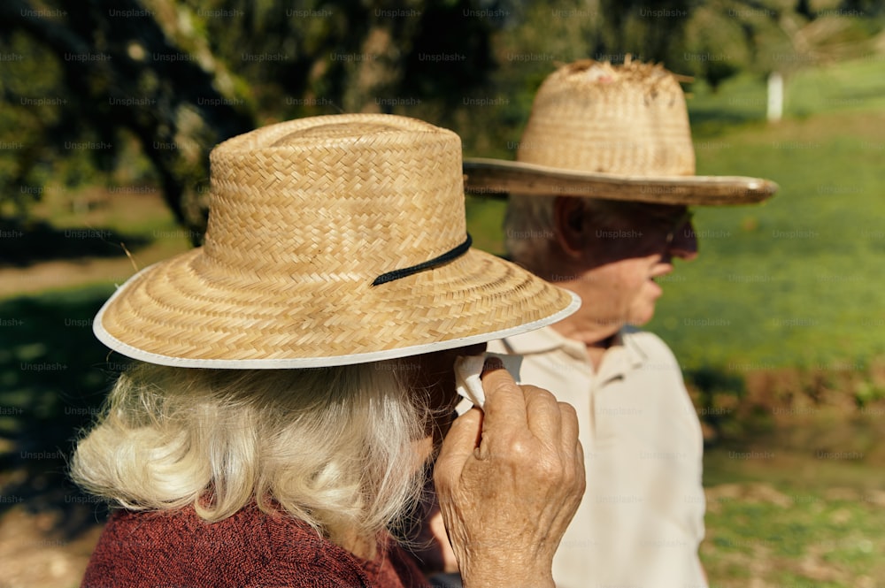 a couple of people that are wearing hats