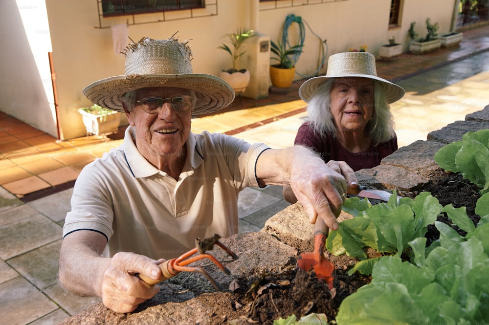 a man and a woman are gardening together