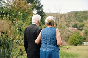 a couple of people that are standing in the grass