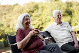 a man and a woman sitting on a bench