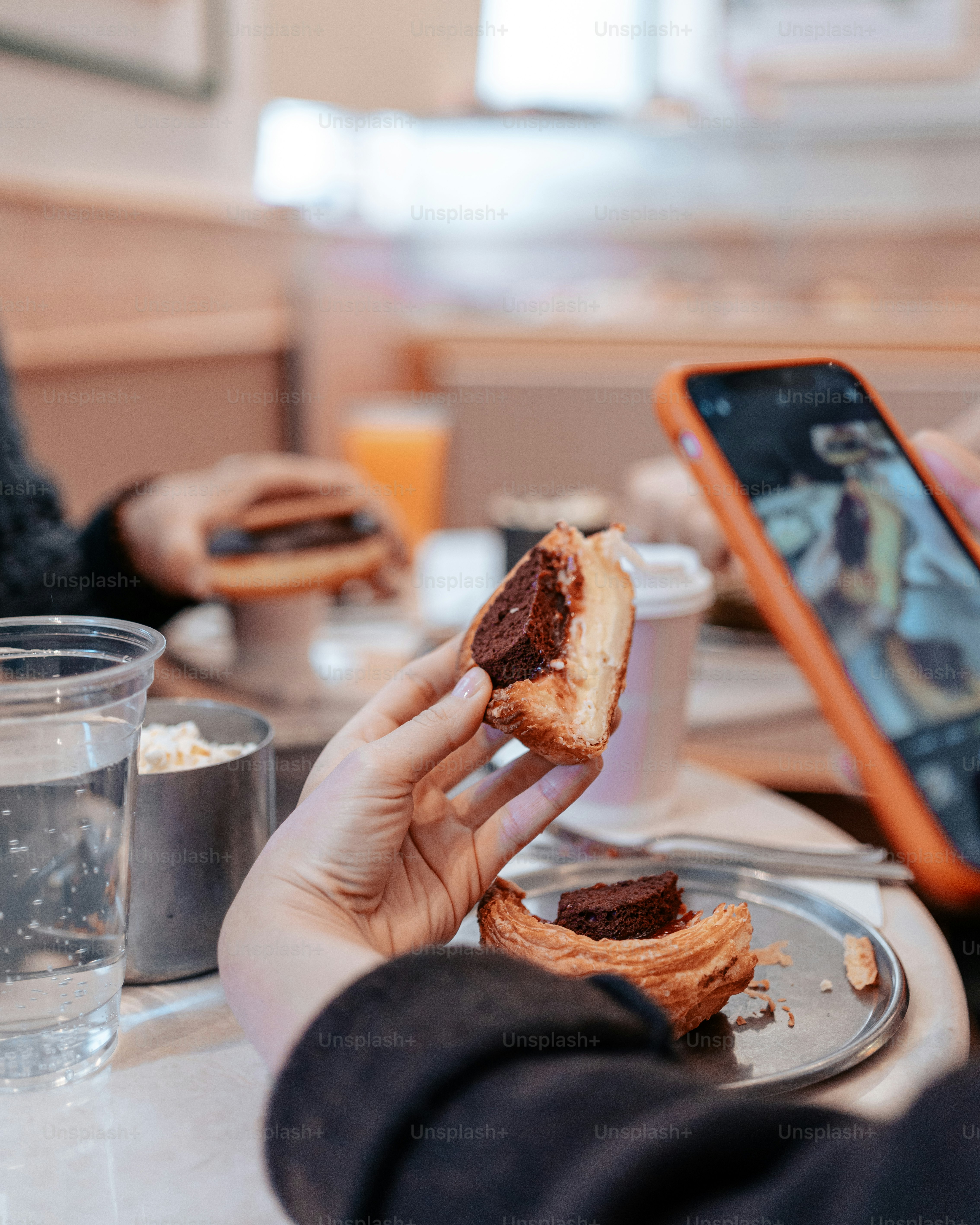 a person sitting at a table with a plate of food