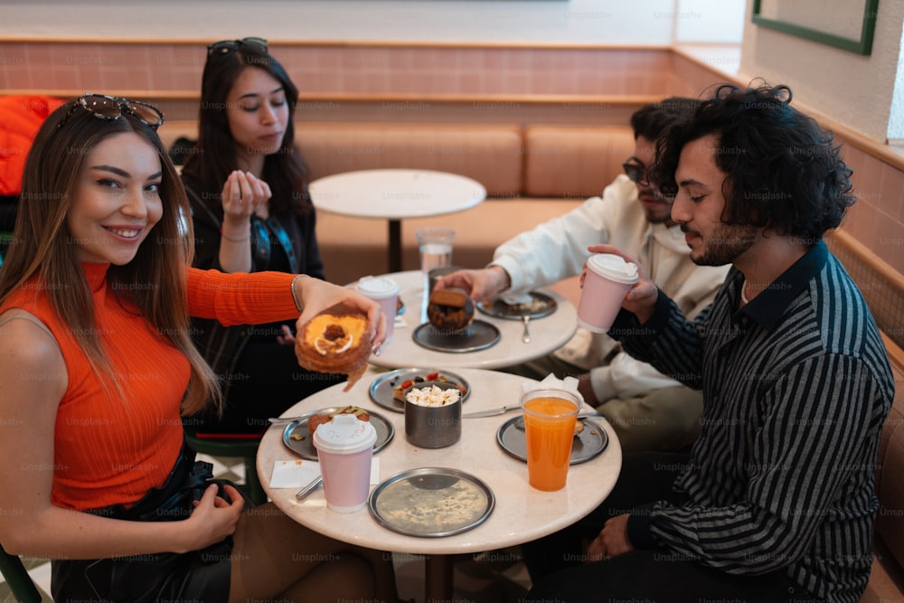 a group of people sitting around a table eating food