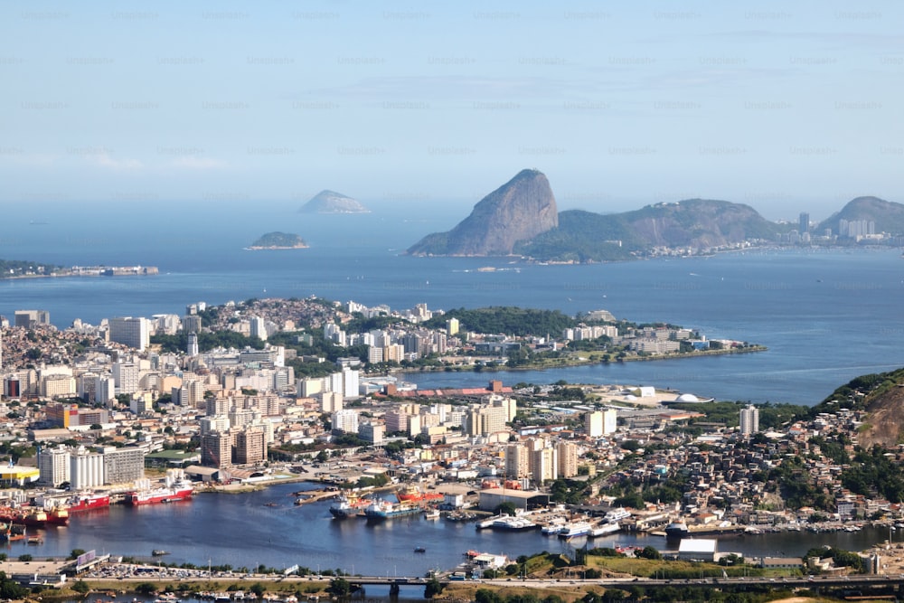 an aerial view of a city with mountains in the background