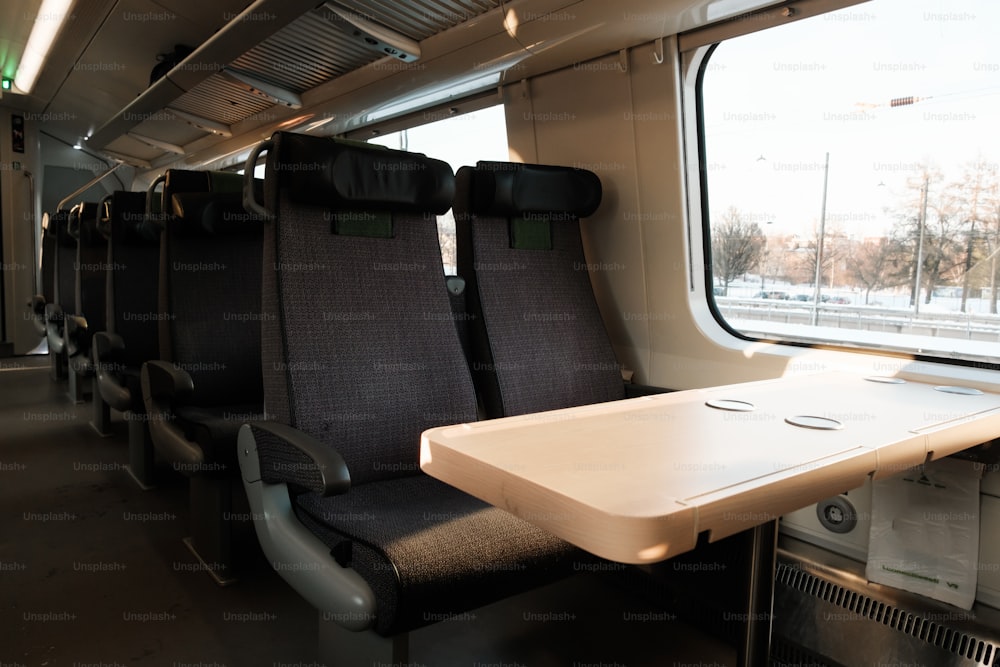 a table and chairs in a train car