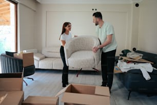 a man standing next to a woman in a living room