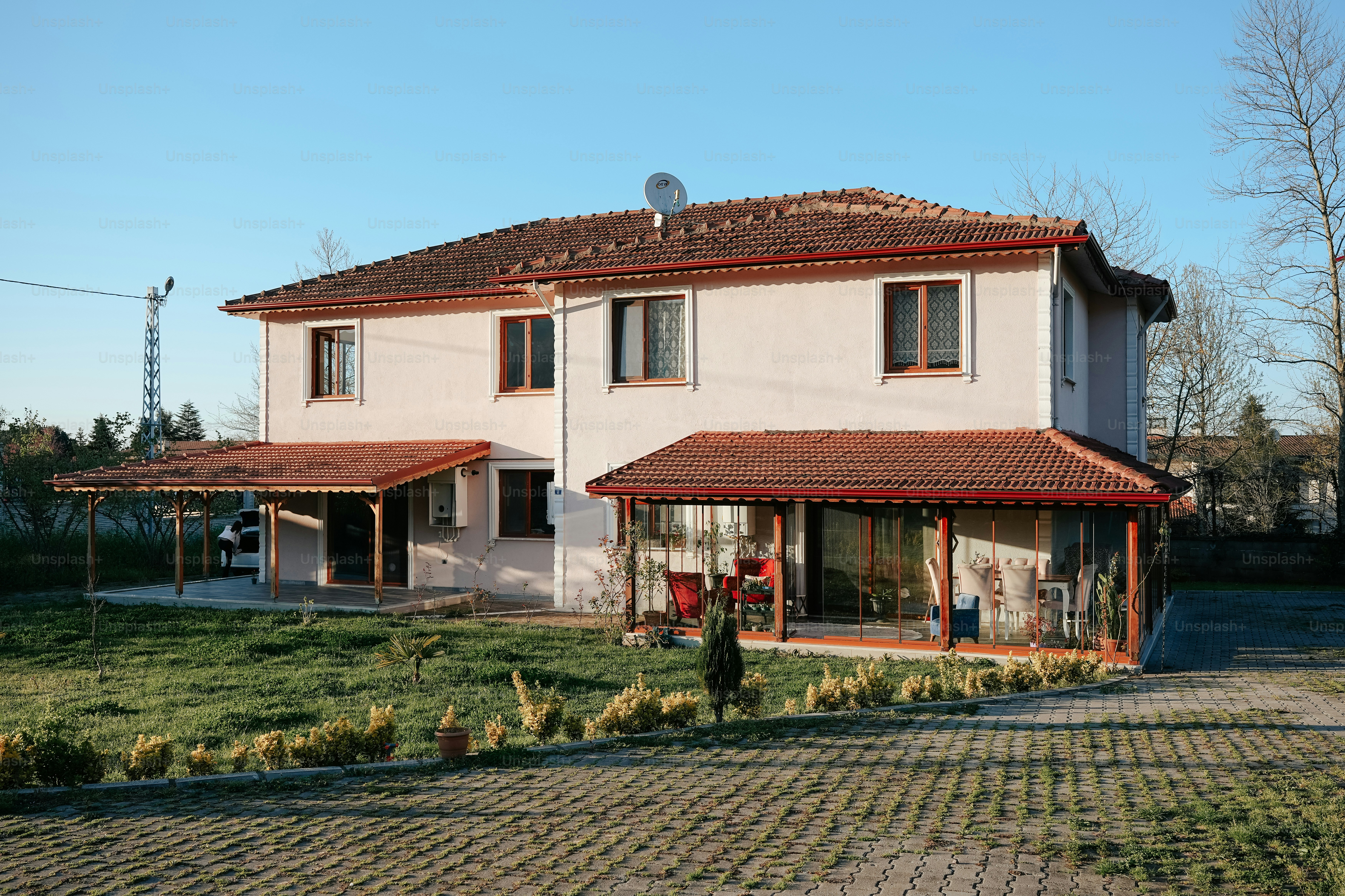 a white house with a red tiled roof