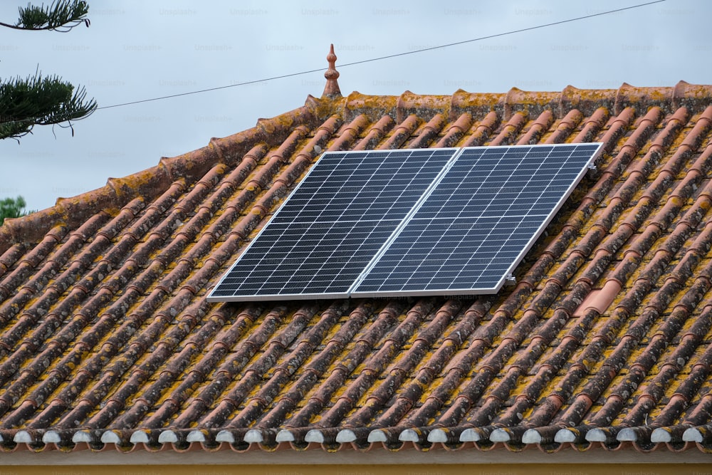 a solar panel on the roof of a house