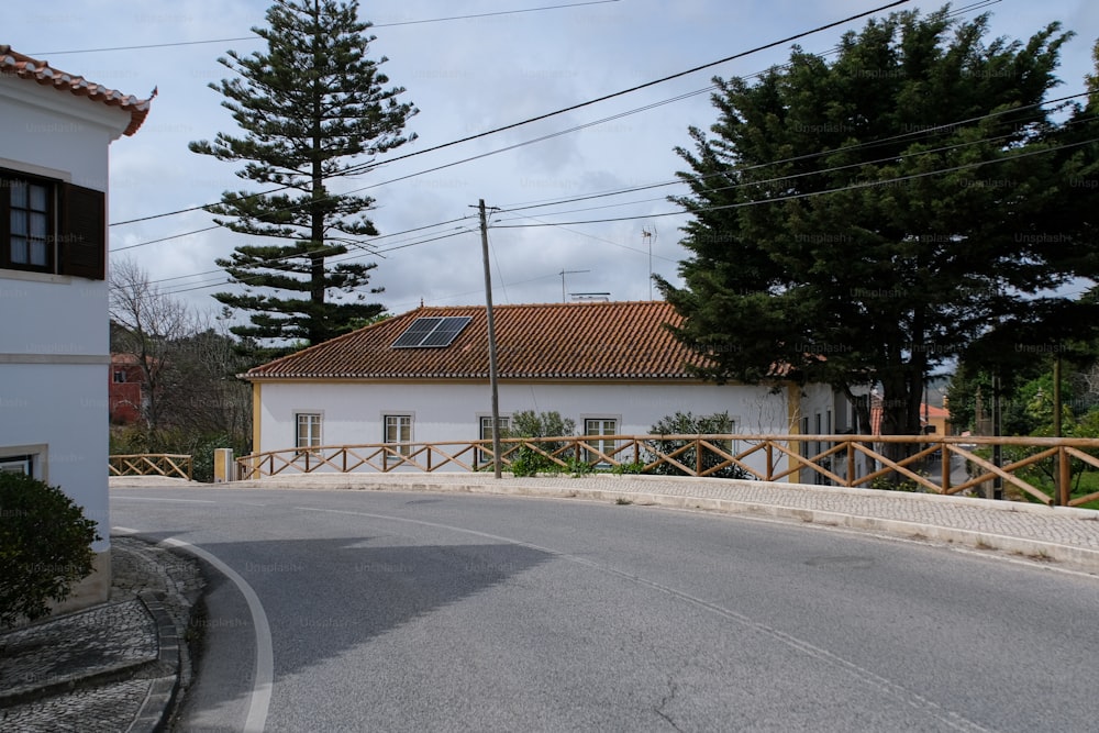 a white house with a red tiled roof