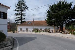 a white house with a red tiled roof