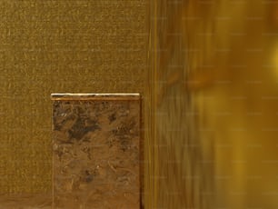 a bathroom with a toilet and a gold wall