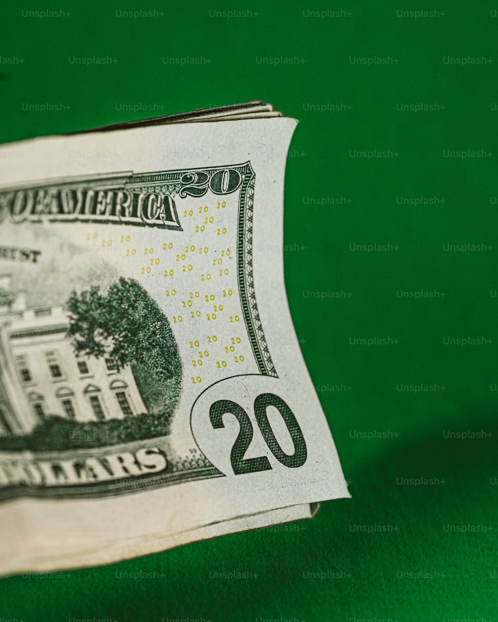 a twenty dollar bill with the white house on it
