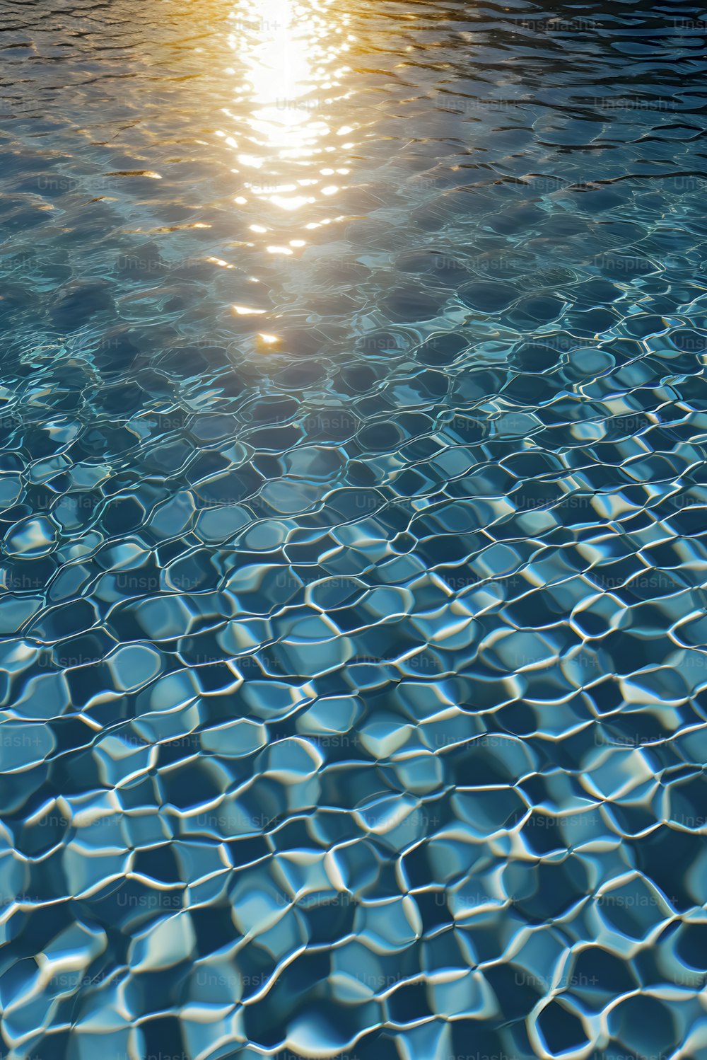 the sun is shining over the water of a swimming pool