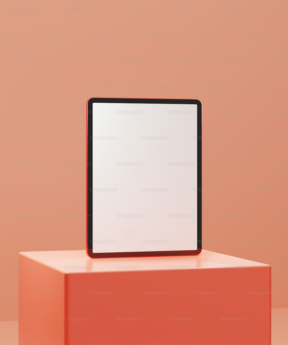 un objet carré surmonté d’un carré blanc